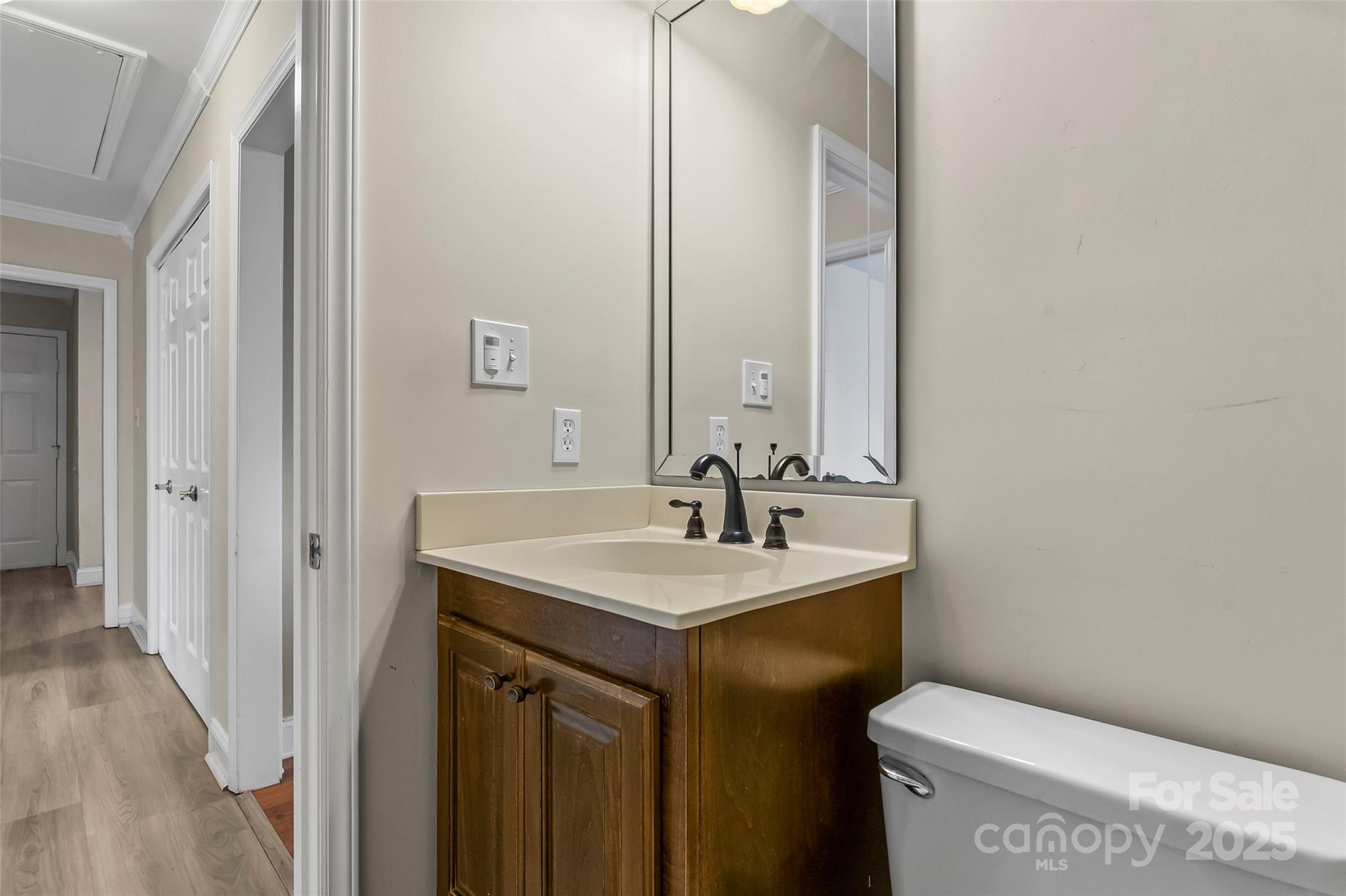3772 Sandy Ford Road Hickory, NC 28602 - Photo 19 of 32 a bathroom with a sink toilet and mirror