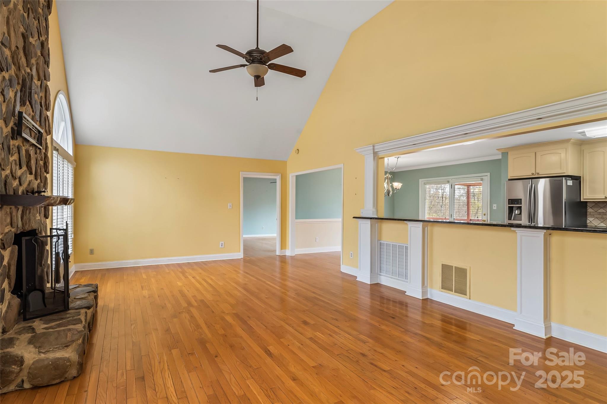 3772 Sandy Ford Road Hickory, NC 28602 - Photo 2 of 32 a view of an empty room with wooden floor and a window