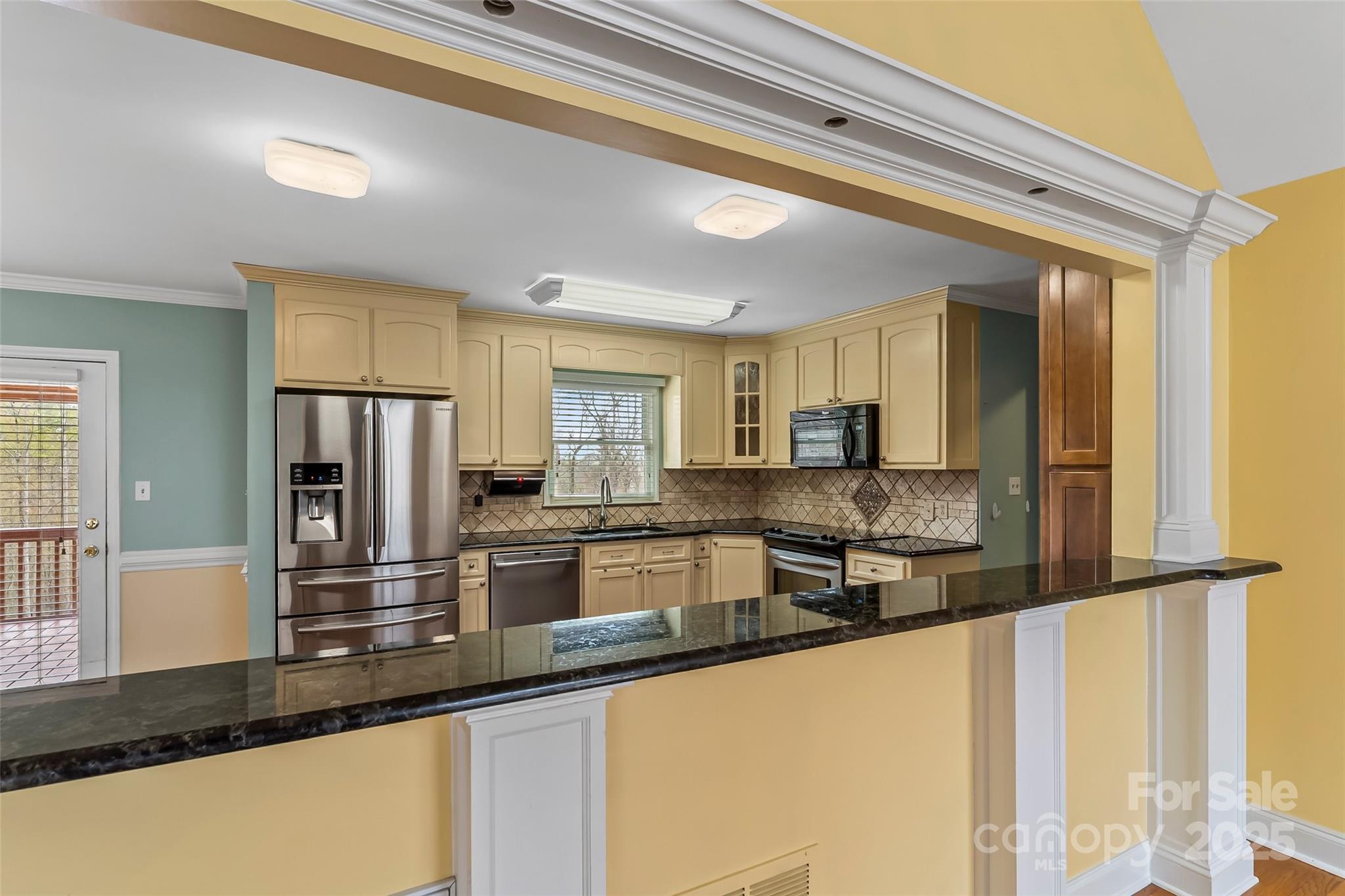 3772 Sandy Ford Road Hickory, NC 28602 - Photo 6 of 32 a kitchen with stainless steel appliances granite countertop a sink refrigerator and cabinets