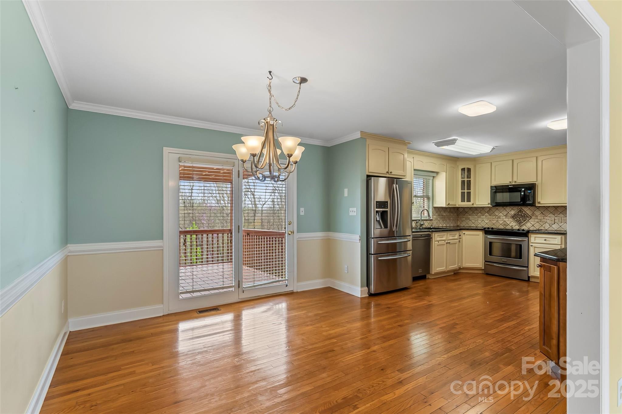 3772 Sandy Ford Road Hickory, NC 28602 - Photo 7 of 32 a open kitchen with stainless steel appliances granite countertop a refrigerator and a stove top oven