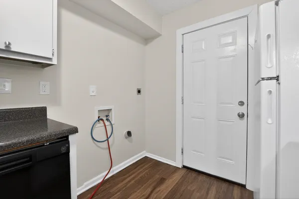 a view of a storage and utility room with cabinet