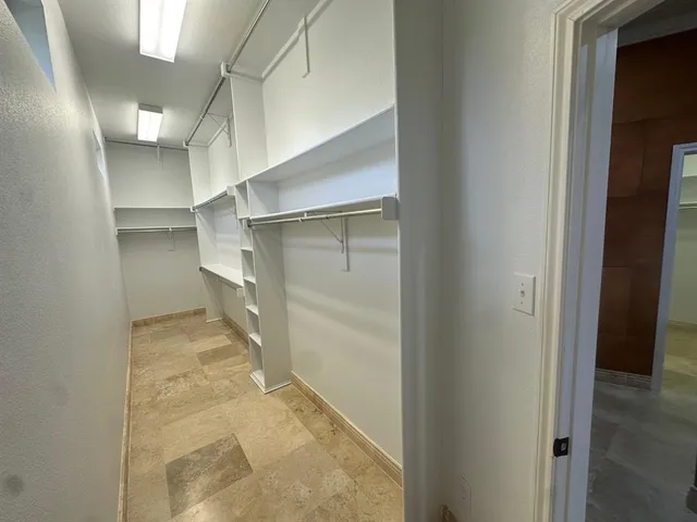 a view of a room with shelves
