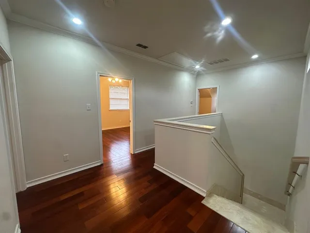 a view of a room with wooden floor and sink