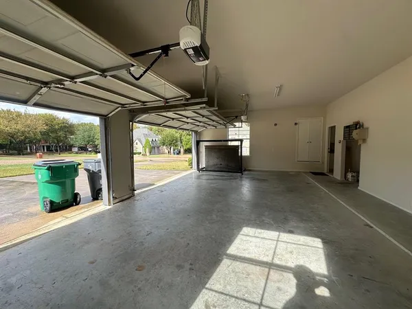 a view of water heater room with wooden floor