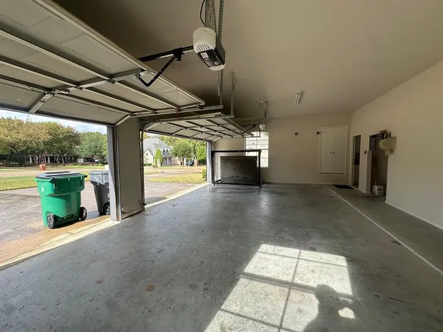 a view of water heater room with wooden floor