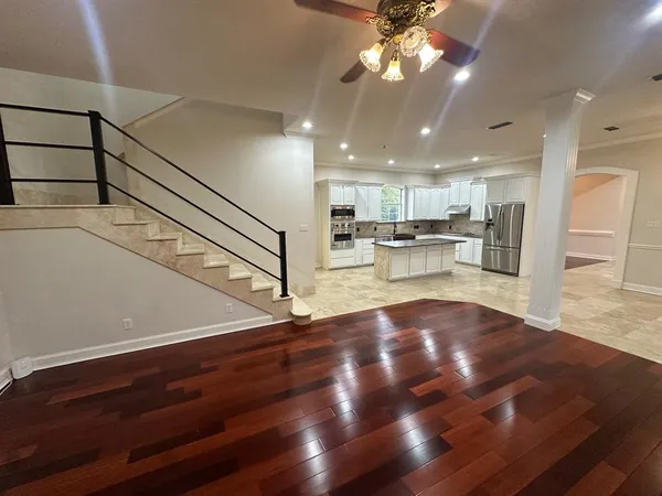 a view of kitchen with cabinets and wooden floor