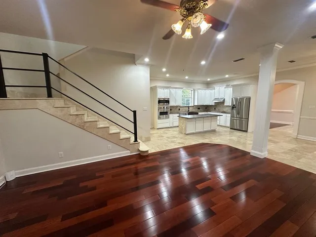 a view of kitchen with cabinets and wooden floor
