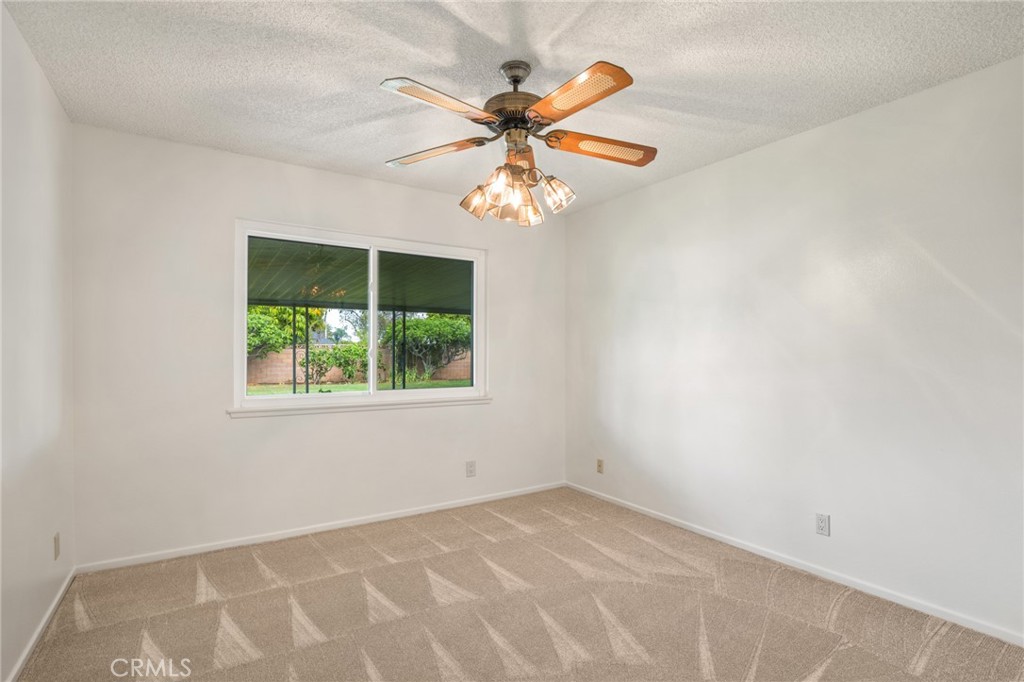 1734 North Vallejo Way Upland, CA 91784 - Photo 21 of 43 an empty room with a window and a fan