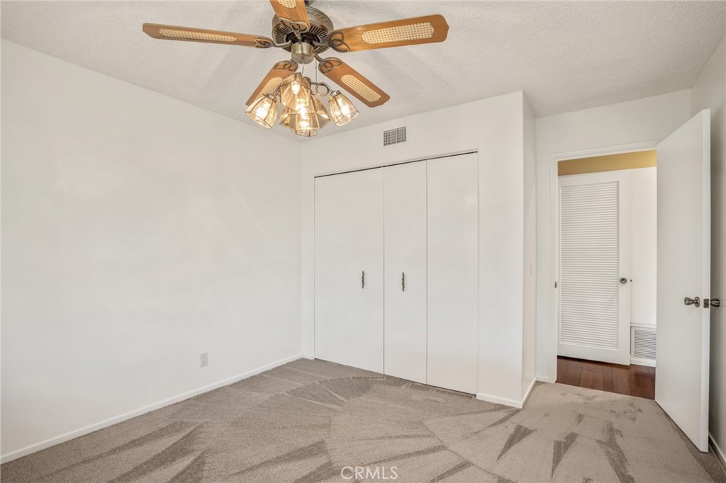 1734 North Vallejo Way Upland, CA 91784 - Photo 22 of 43 a view of a chandelier fan in closet