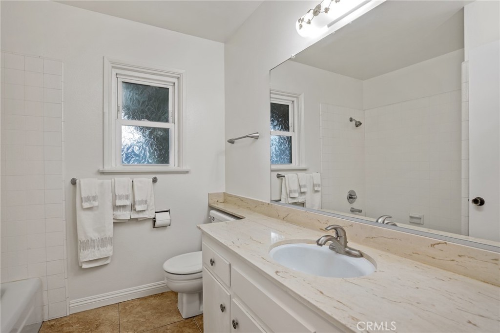 1734 North Vallejo Way Upland, CA 91784 - Photo 23 of 43 a bathroom with a sink toilet and mirror