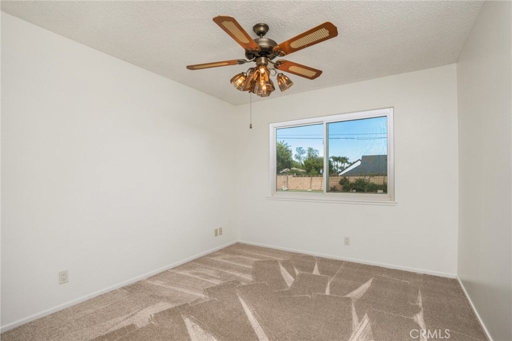 1734 North Vallejo Way Upland, CA 91784 - Photo 25 of 43 an empty room with window and ceiling fan