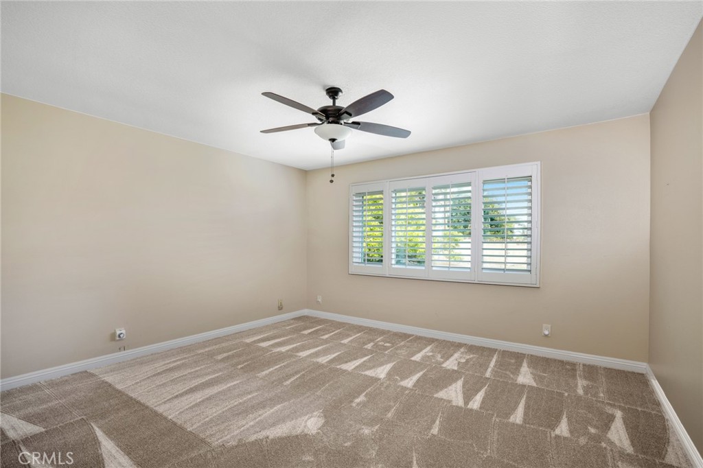 1734 North Vallejo Way Upland, CA 91784 - Photo 31 of 43 a view of a room with a ceiling fan and a window