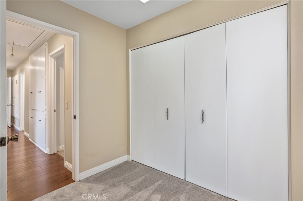 1734 North Vallejo Way Upland, CA 91784 - Photo 34 of 43 a view of a hallway with wooden floor