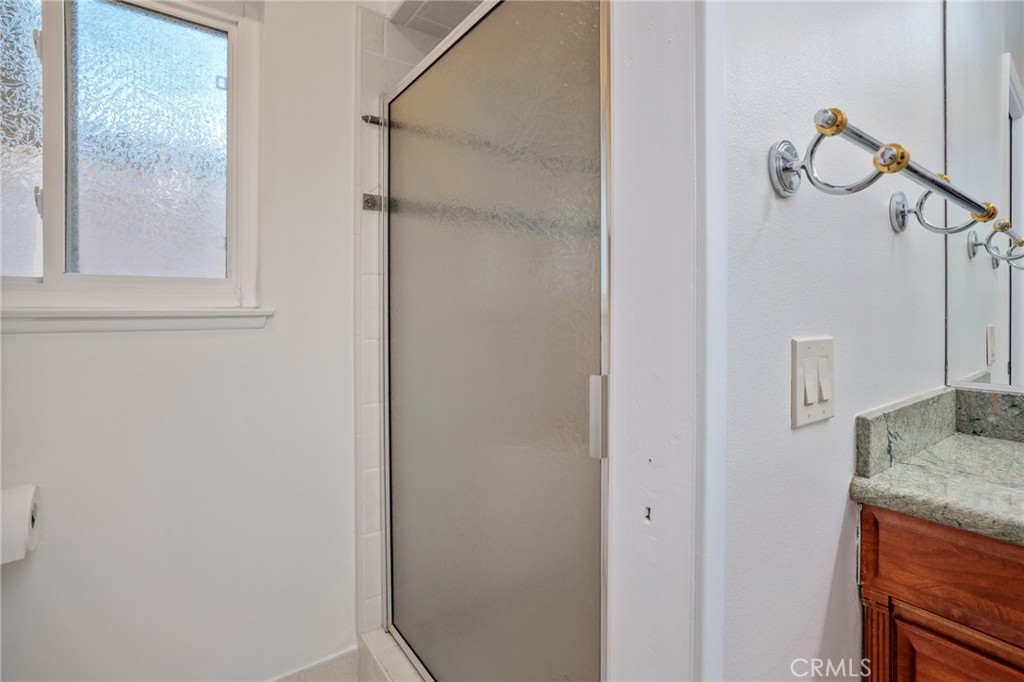 1734 North Vallejo Way Upland, CA 91784 - Photo 37 of 43 a bathroom with a granite countertop sink and mirror