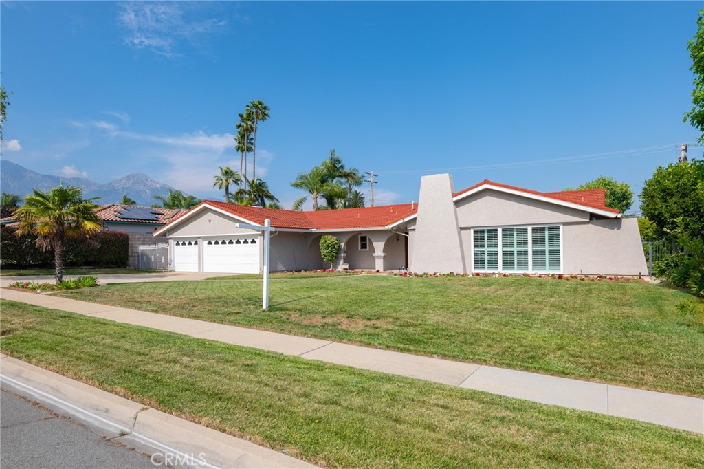 1734 North Vallejo Way Upland, CA 91784 - Photo 4 of 43 a house with green field in front of it