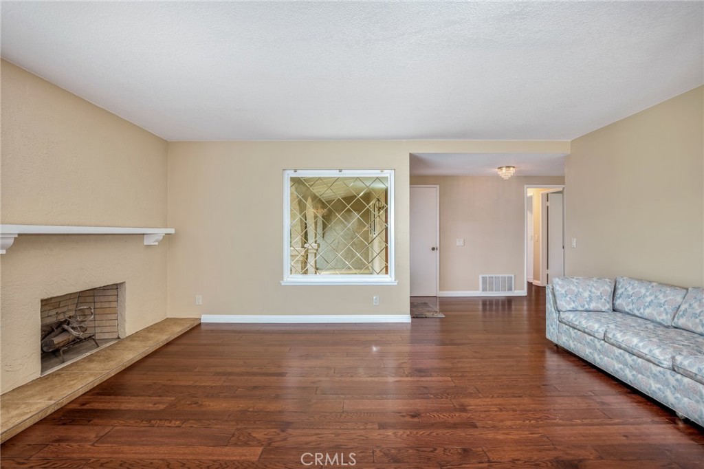 1734 North Vallejo Way Upland, CA 91784 - Photo 6 of 43 a view of livingroom with furniture wooden floor and window