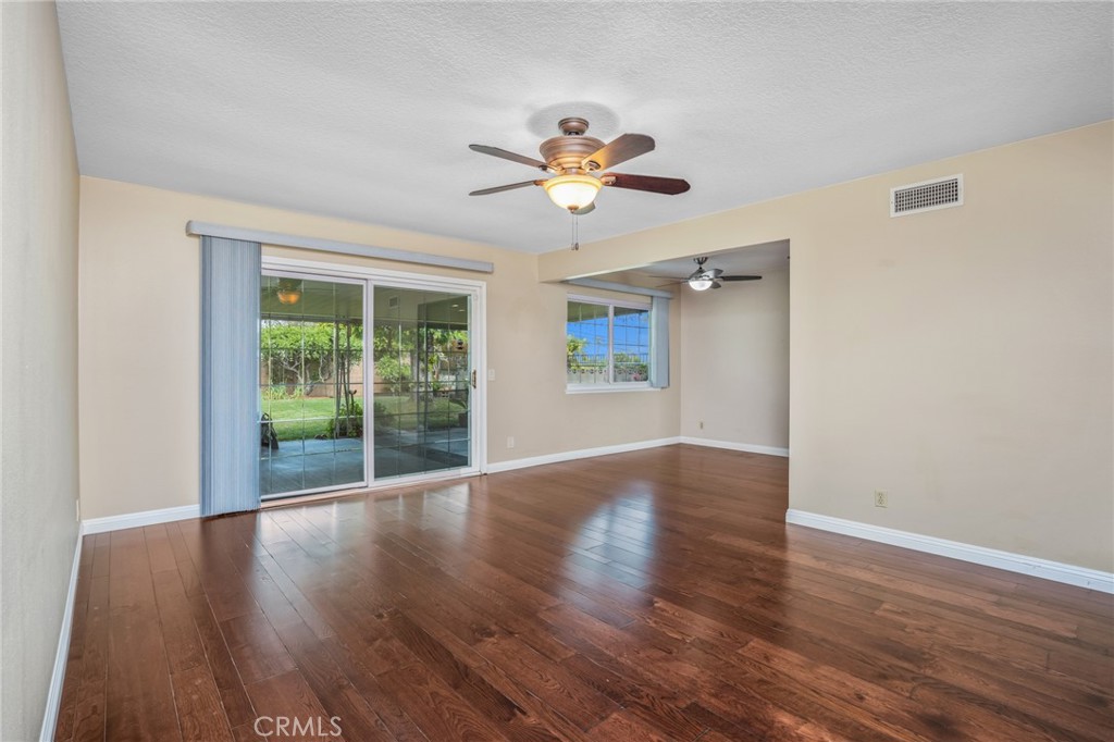 1734 North Vallejo Way Upland, CA 91784 - Photo 9 of 43 a view of an empty room with window and wooden floor