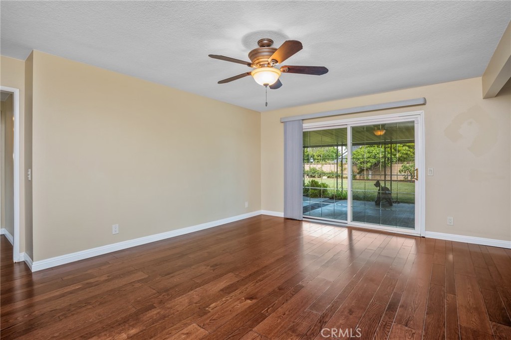 1734 North Vallejo Way Upland, CA 91784 - Photo 10 of 43 a view of a room with wooden floor fan and a window