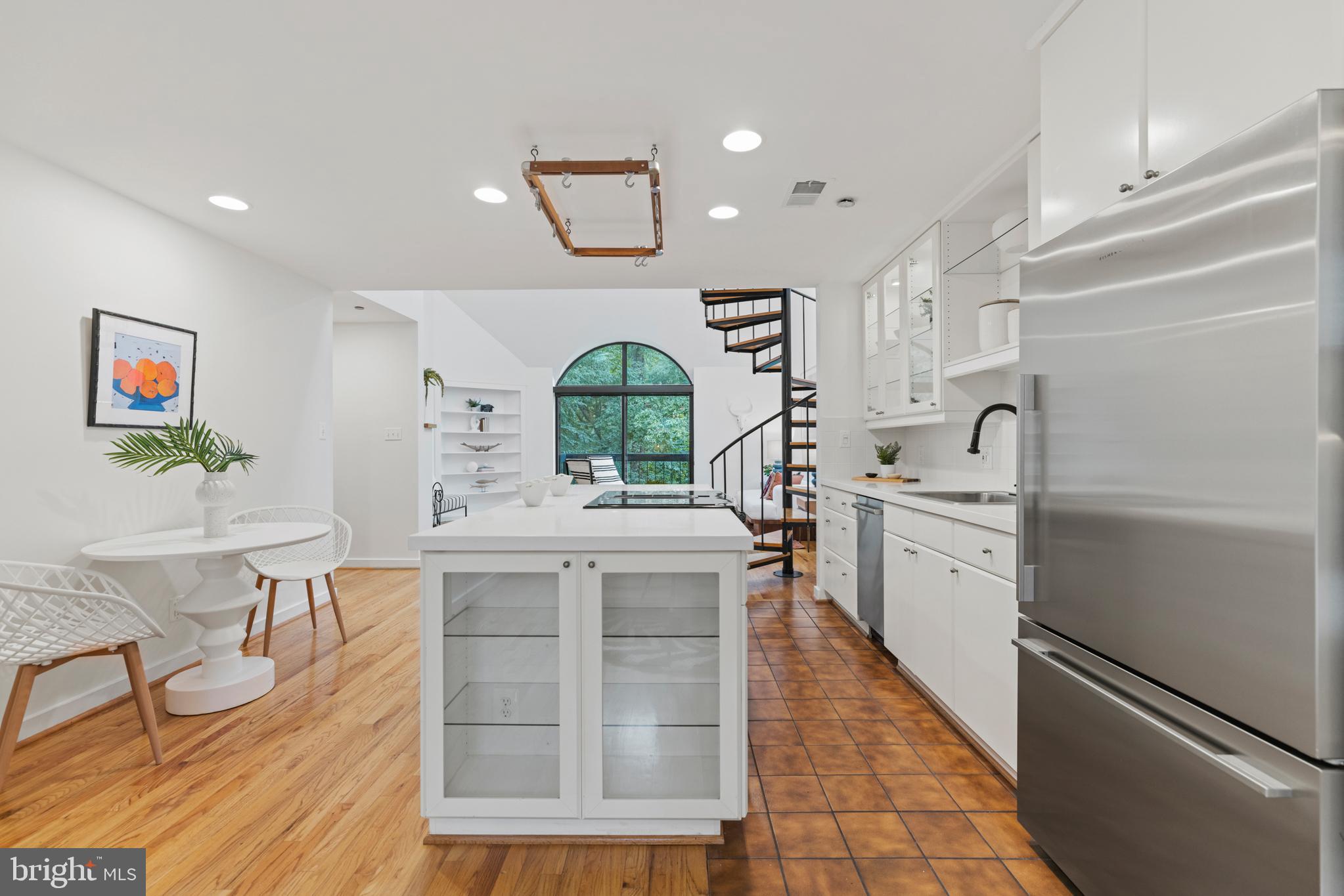 3517 17th Street Northwest, Unit 10 Washington, DC 20010 - Photo 15 of 35 a kitchen with a sink cabinets and window