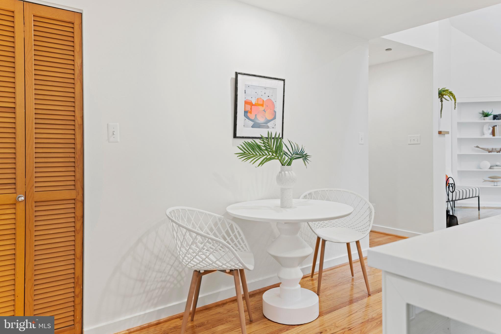 3517 17th Street Northwest, Unit 10 Washington, DC 20010 - Photo 16 of 35 a view of a dining room with furniture and wooden floor