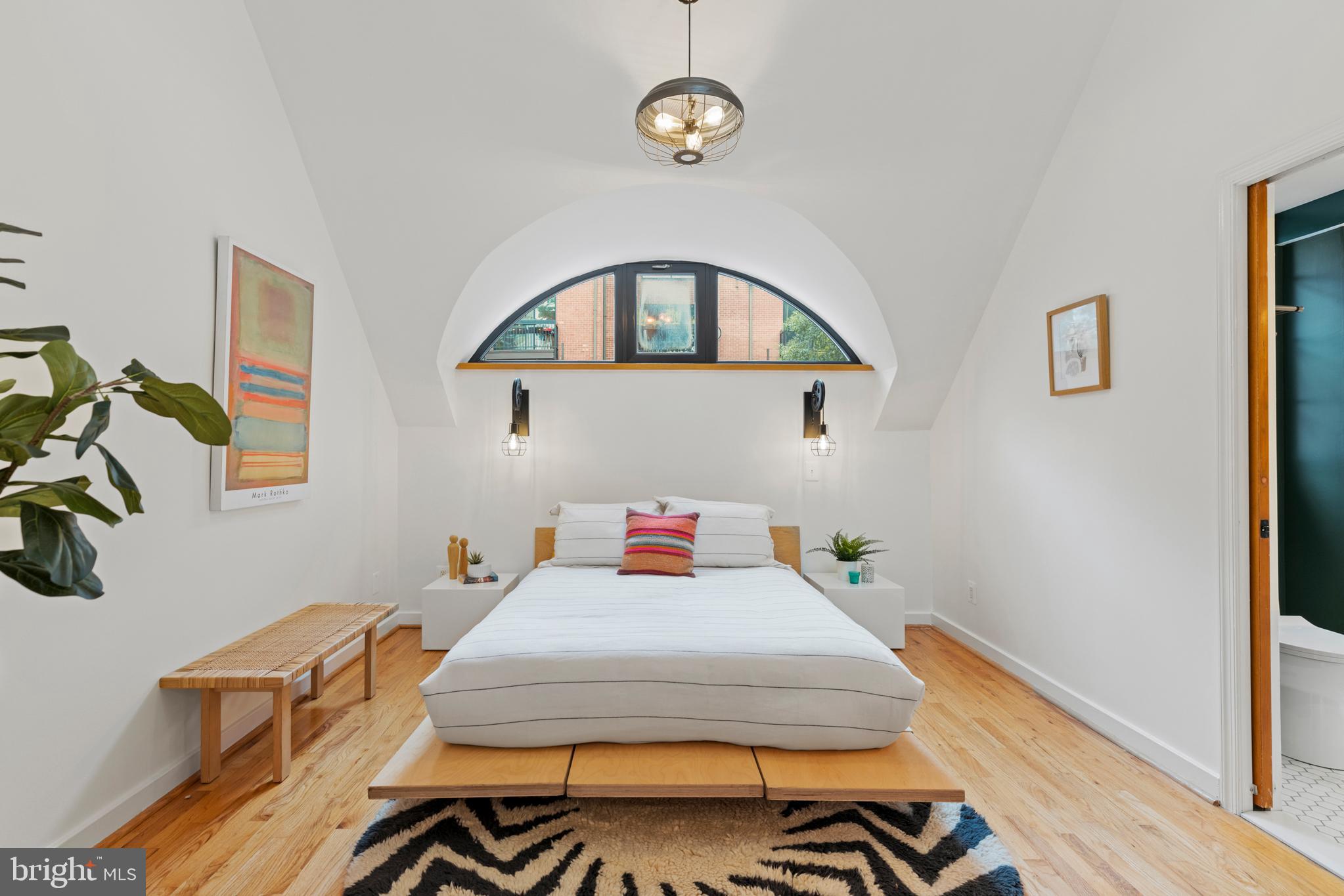 3517 17th Street Northwest, Unit 10 Washington, DC 20010 - Photo 19 of 35 a bedroom with a bed and a table in it