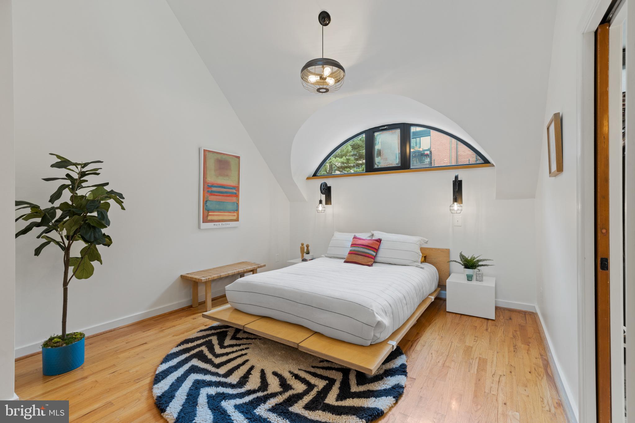 3517 17th Street Northwest, Unit 10 Washington, DC 20010 - Photo 20 of 35 a bedroom with a bed and a chandelier