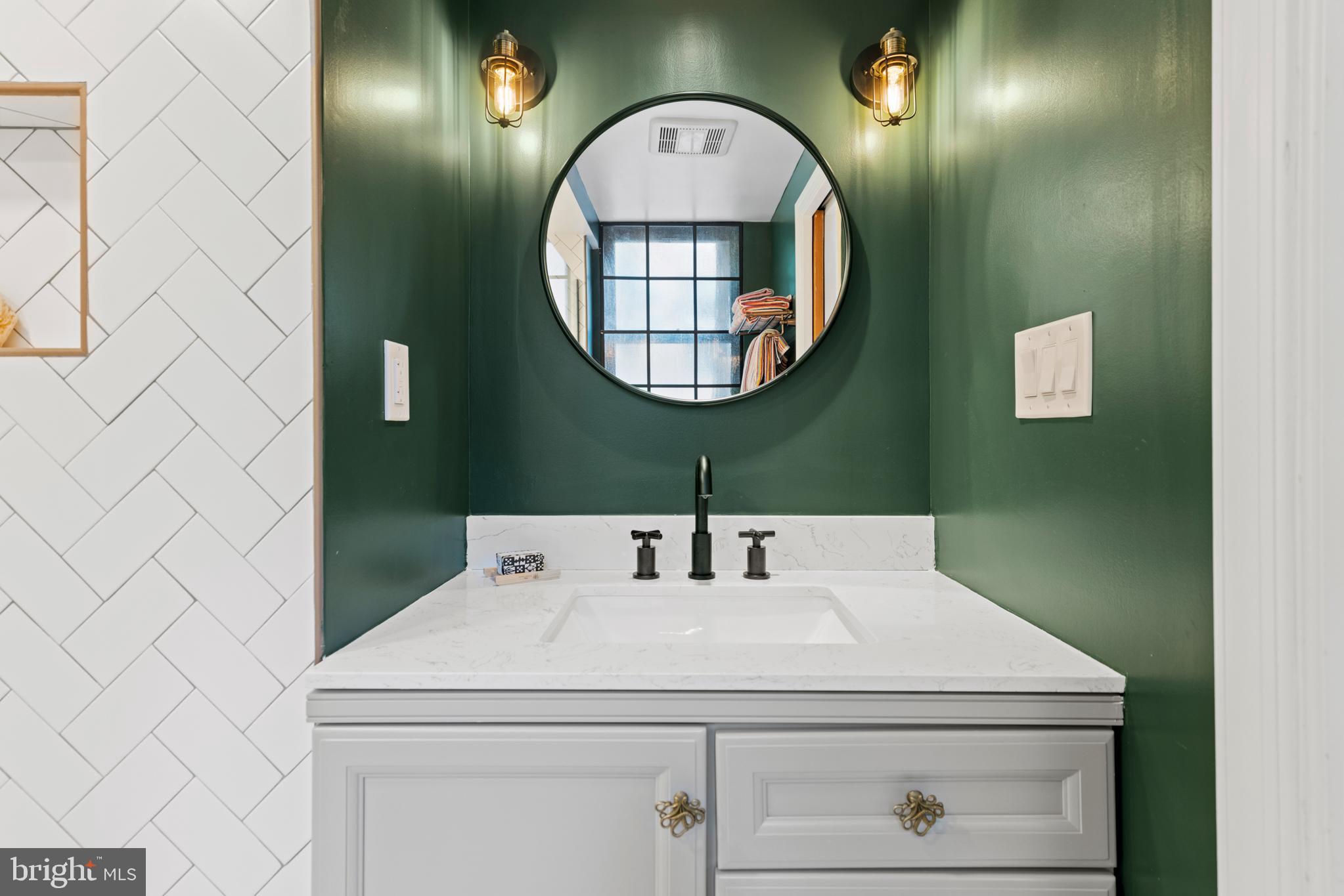 3517 17th Street Northwest, Unit 10 Washington, DC 20010 - Photo 23 of 35 a bathroom with a sink and mirror
