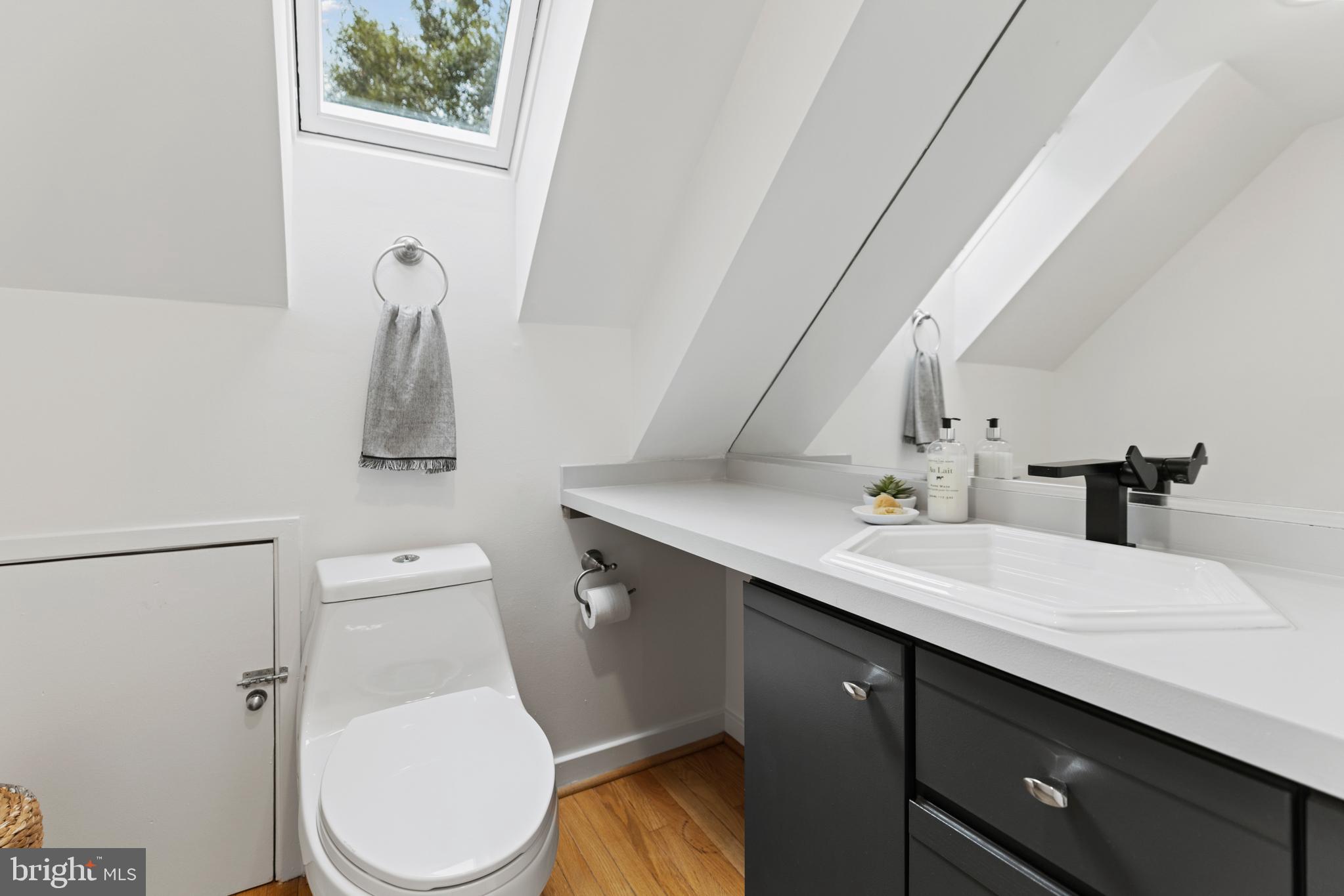 3517 17th Street Northwest, Unit 10 Washington, DC 20010 - Photo 31 of 35 a bathroom with a sink a toilet and vanity