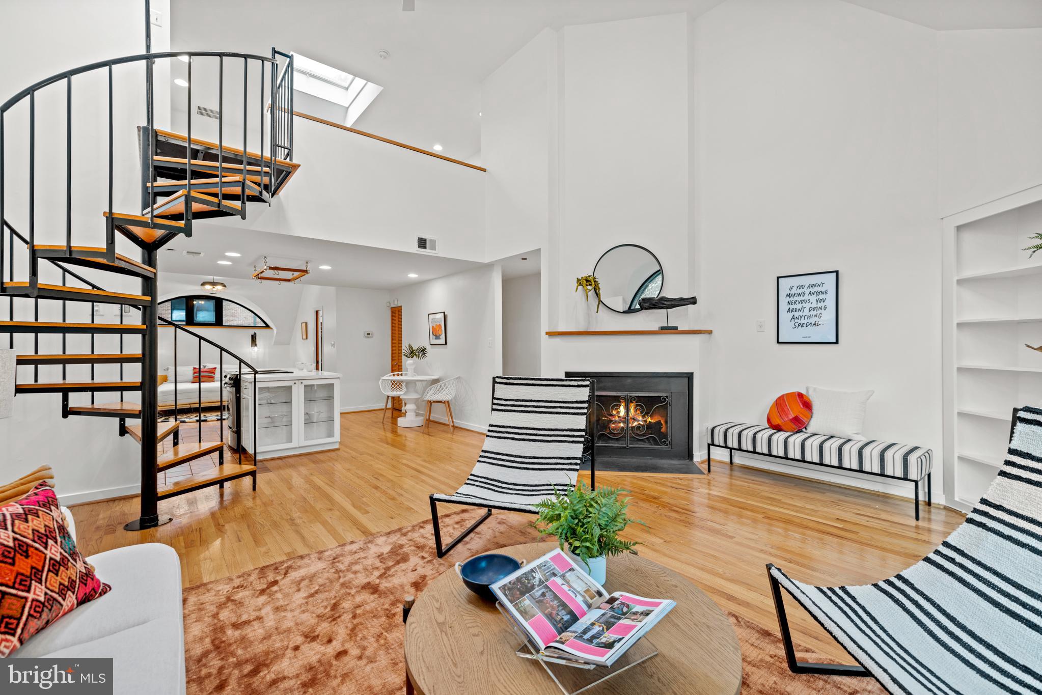 3517 17th Street Northwest, Unit 10 Washington, DC 20010 - Photo 5 of 35 a living room with furniture and a fireplace