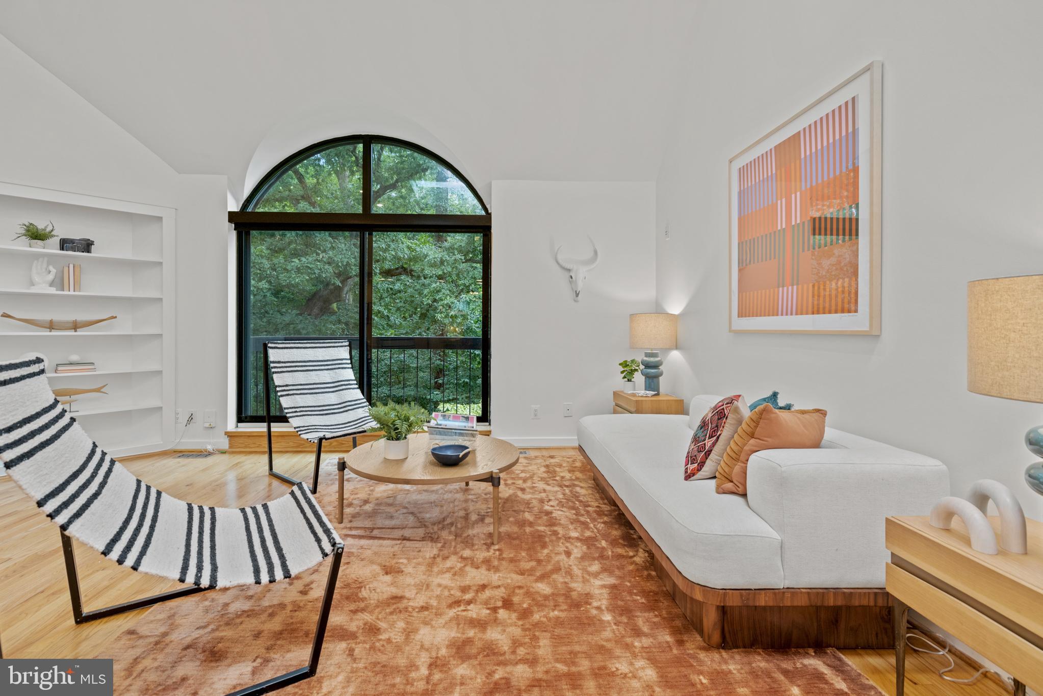 3517 17th Street Northwest, Unit 10 Washington, DC 20010 - Photo 6 of 35 a living room with furniture and a large window