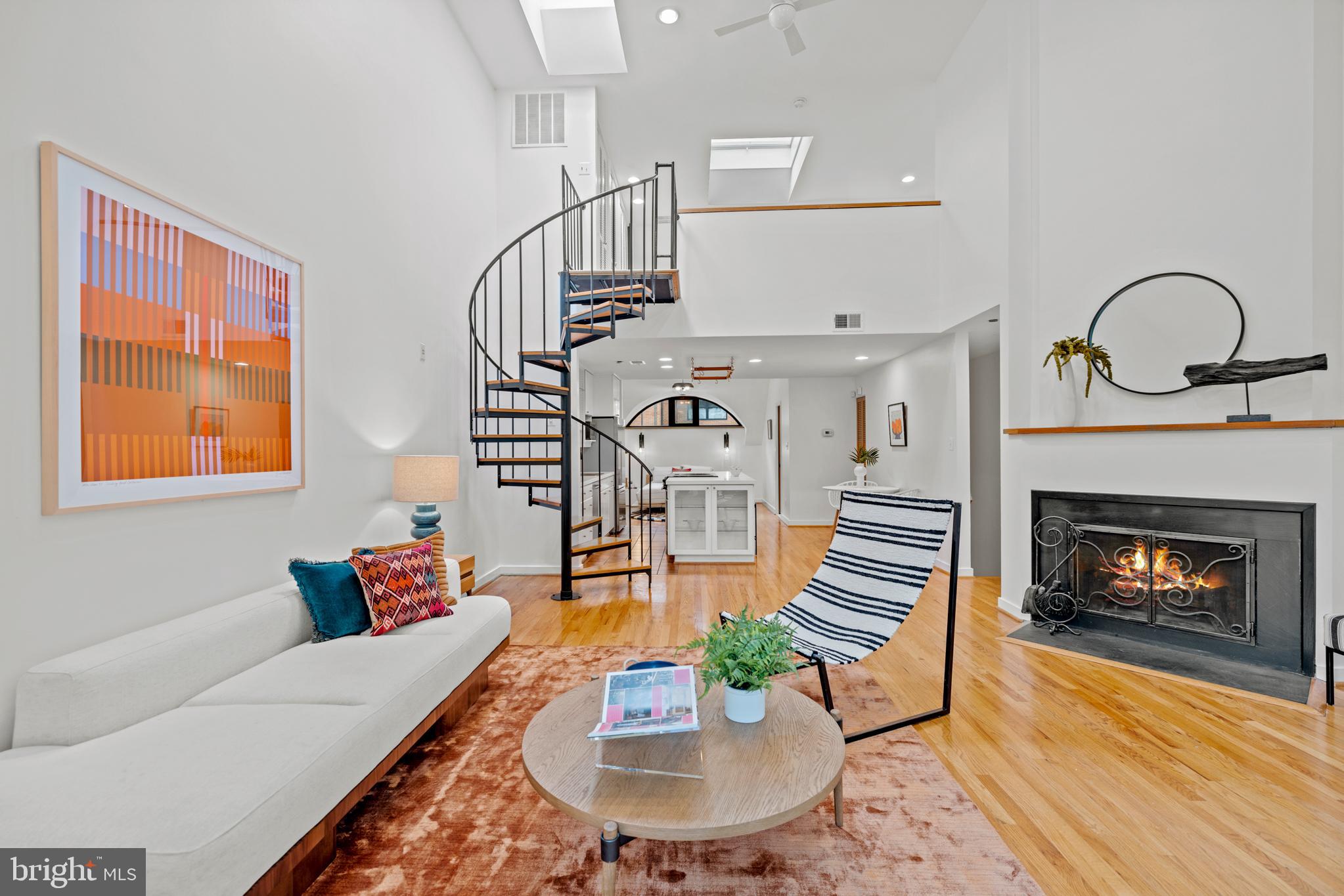 3517 17th Street Northwest, Unit 10 Washington, DC 20010 - Photo 7 of 35 a living room with furniture and a fireplace