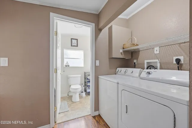 a living room with furniture and a lamp