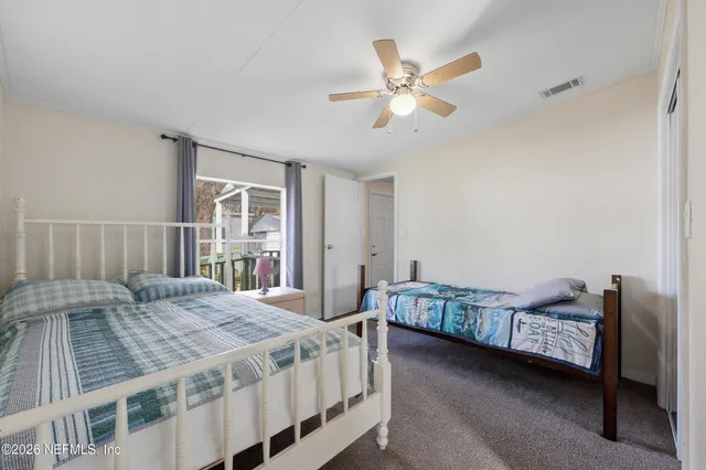 a bathroom with a sink toilet a mirror and shower