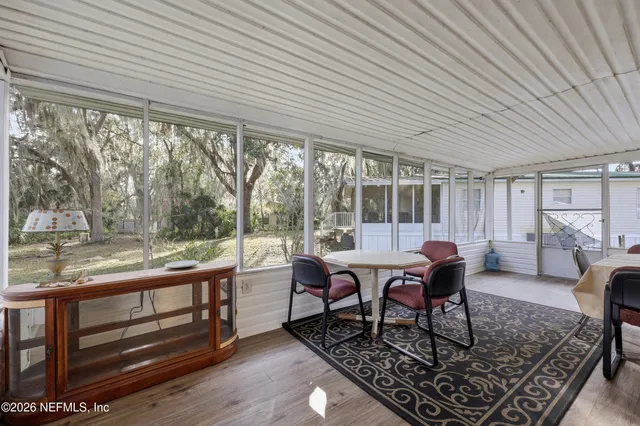 a view of a balcony with wooden floor