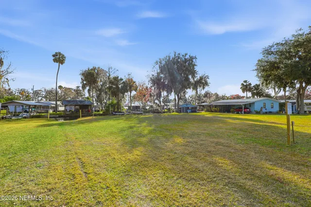 a view of a lake with trees