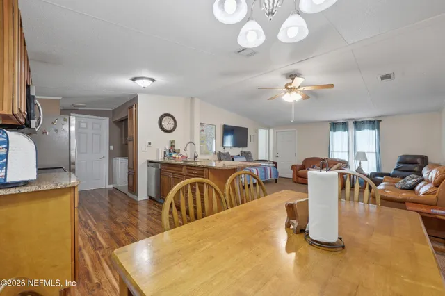 a view of a dining room with furniture