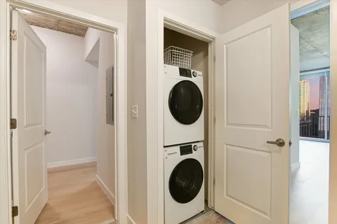 a view of a hallway with washer and dryer