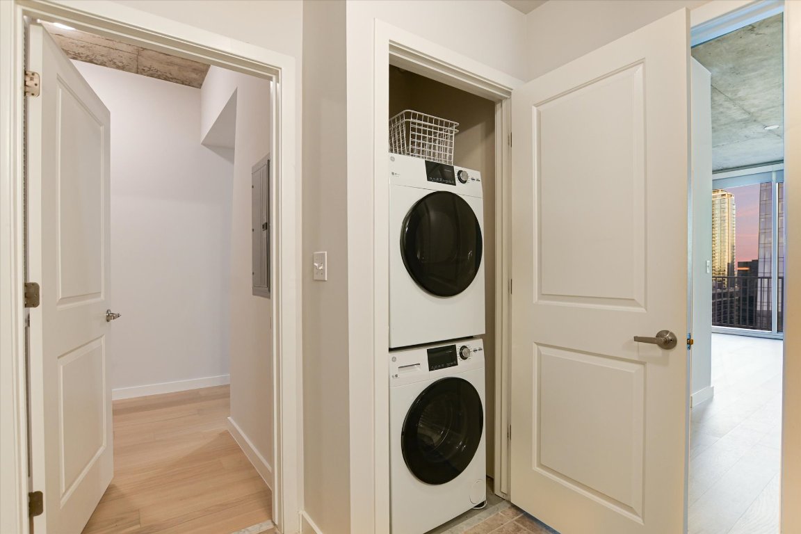 360 Nueces Street, Unit 3207 Austin, TX 78701 - Photo 17 of 30 a view of a hallway with washer and dryer