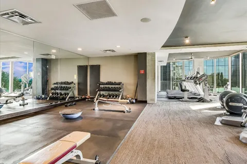 a room with lots of furniture and a large window