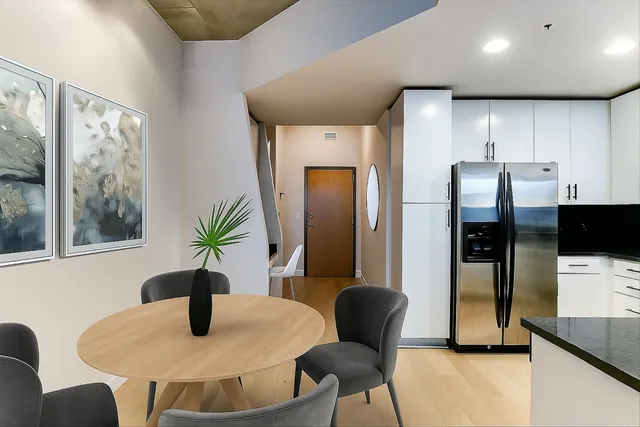 a dining room with furniture and window