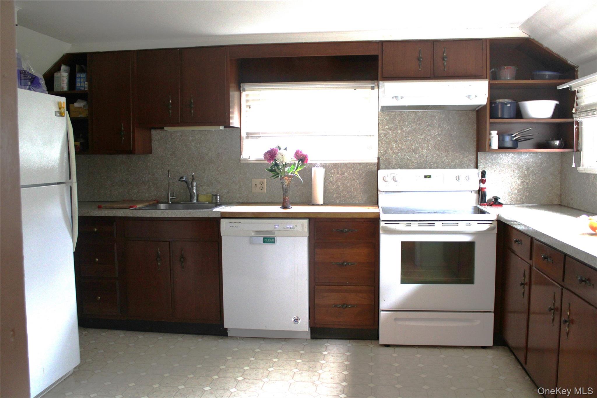 163 Bower Road Pleasant Valley, NY 12603 - Photo 6 of 11 Sunny Kitchen with light flooring, light countertops, and backsplash.