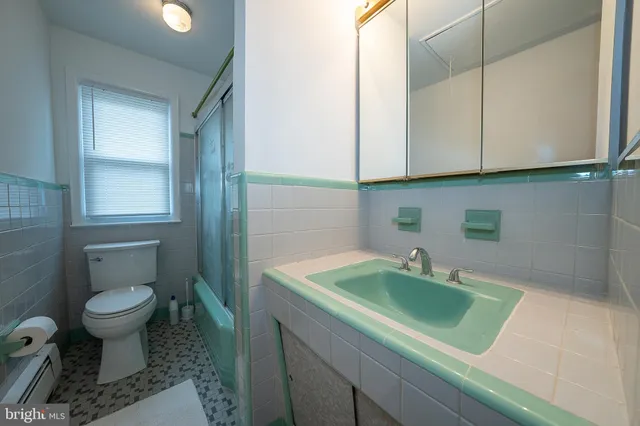 a bathroom with a sink toilet and vanity
