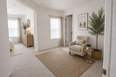 a living room with furniture and a potted plant