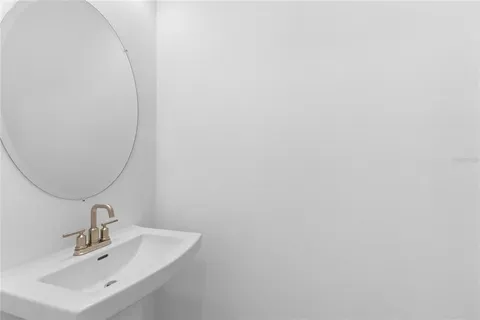 a bathroom with a sink and mirror