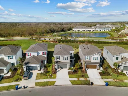 an aerial view of a house with a lake view