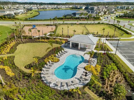 an aerial view of a house with a swimming pool
