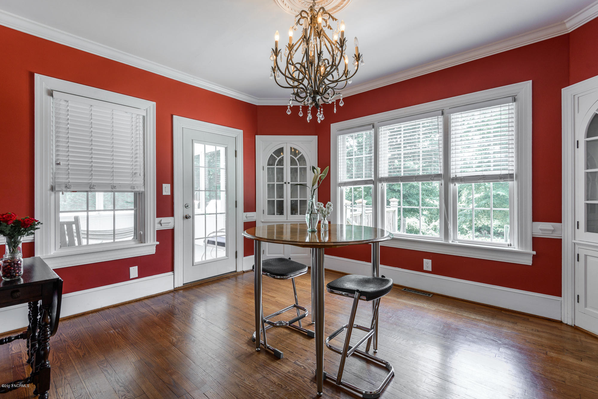 1100 West Rock Spring Road Greenville, NC 27858 - Photo 13 of 51 formal dining leads to screened in porch