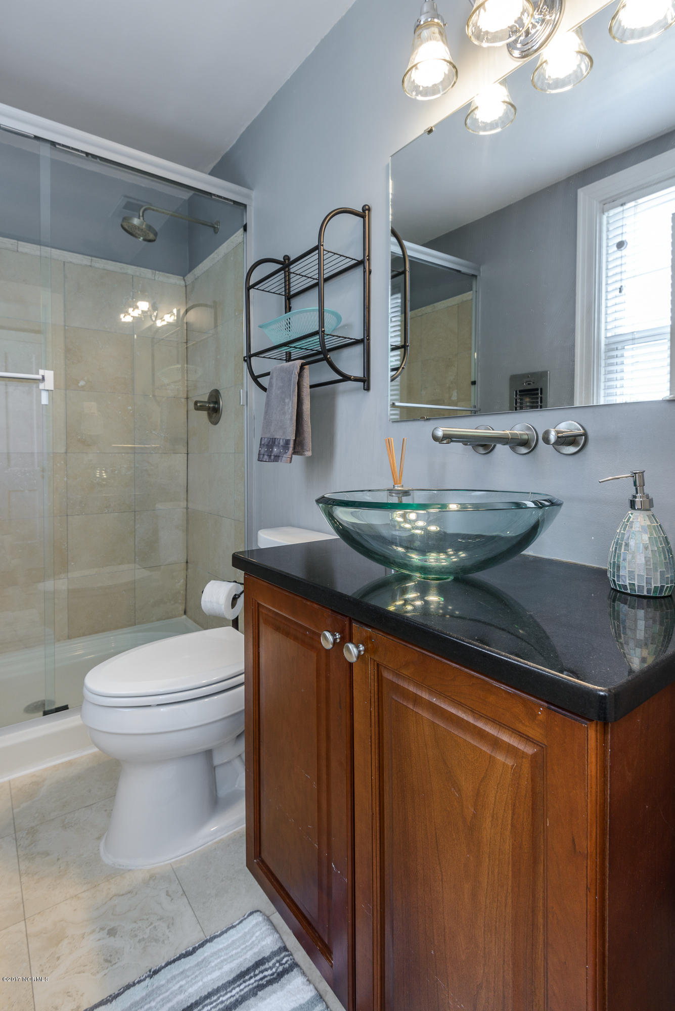 1100 West Rock Spring Road Greenville, NC 27858 - Photo 34 of 51 3rd full bath upstairs with travertine tile