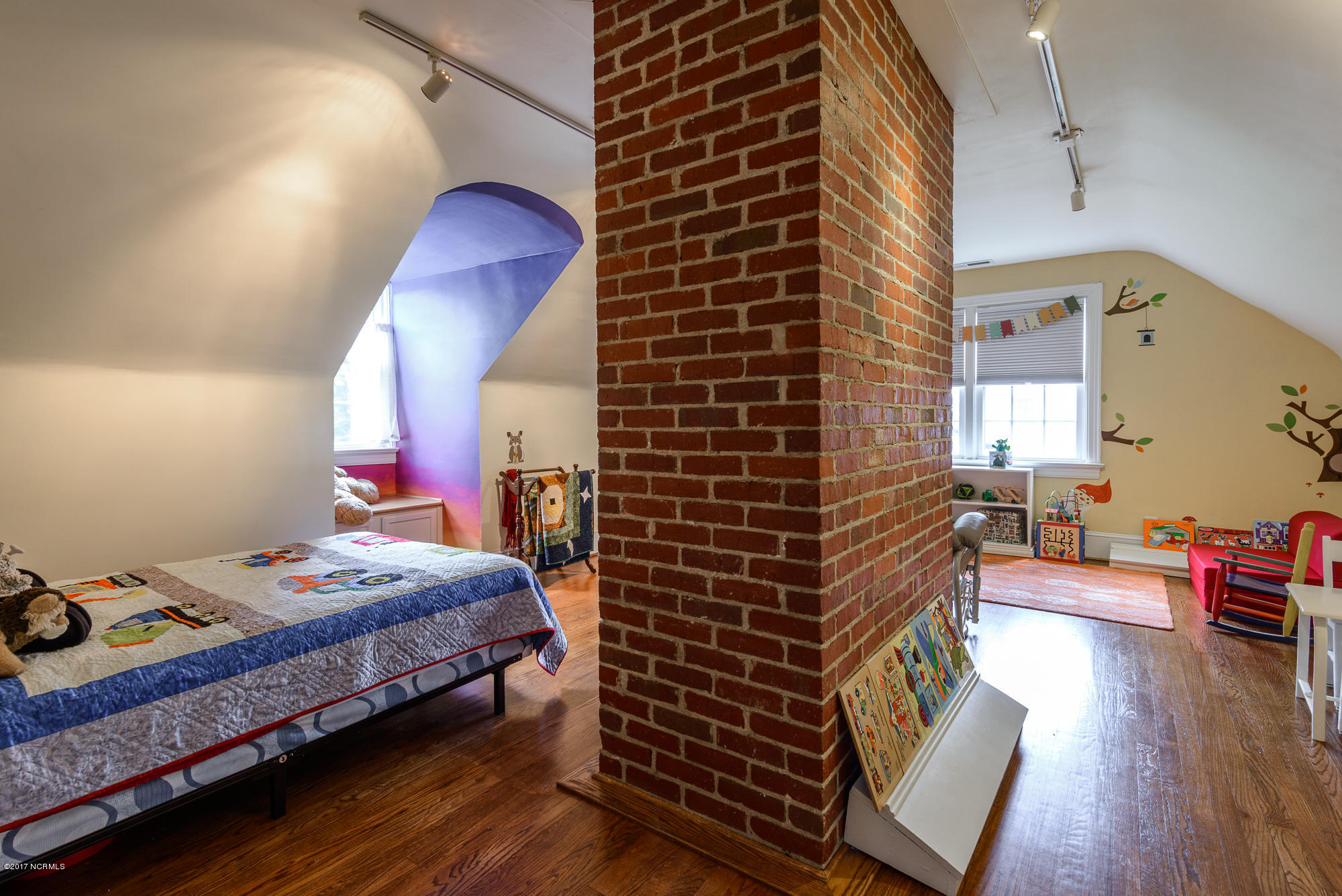 1100 West Rock Spring Road Greenville, NC 27858 - Photo 35 of 51 3rd bedroom with exposed brick chimney from 1st floor living room, walk-in closet