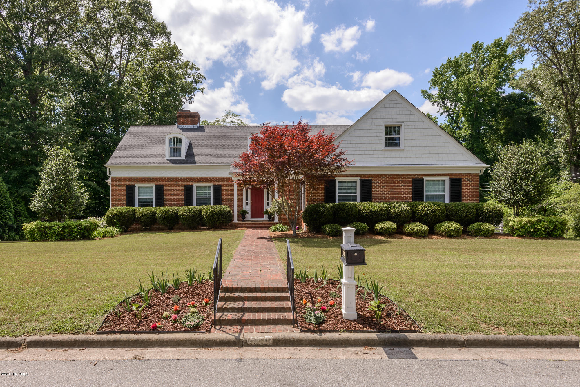 1100 West Rock Spring Road Greenville, NC 27858 - Photo 4 of 51 Brick paver walkway & iron handrails leading to the front door